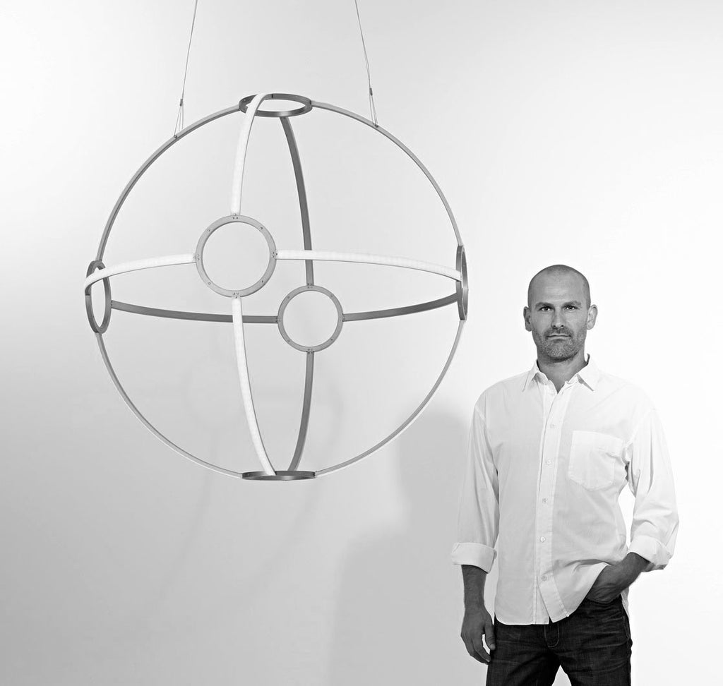 Designer Peter Straka and chandelier ONA 100 by Kaia