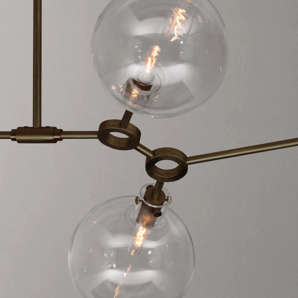 large modern chandelier in aged brass ORA 8 PENDANT detail by KAIA